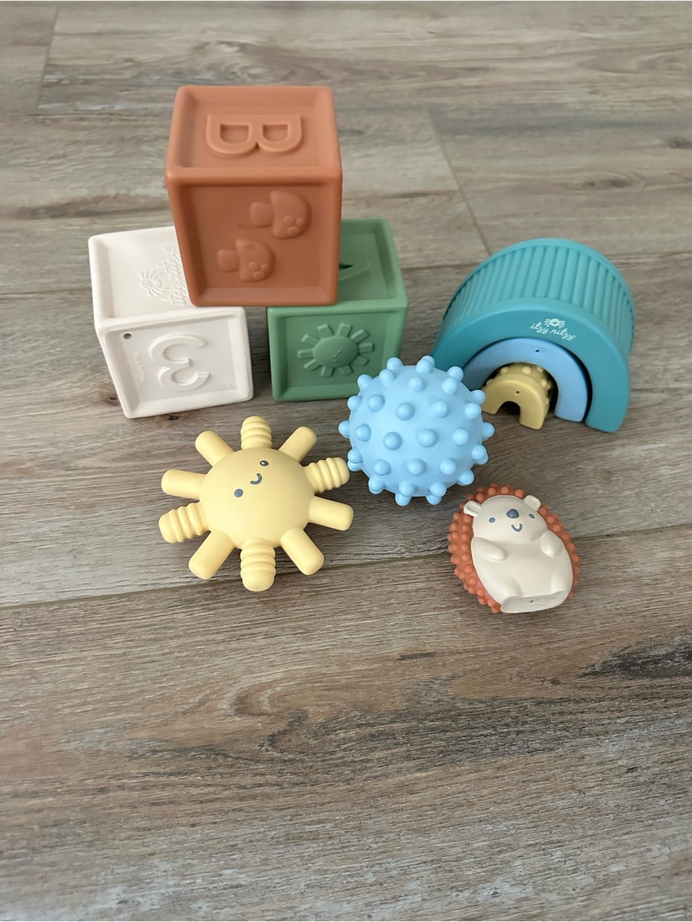 Itzy Ritzy Sensory Stack & Squeeze Toy Set - Cream, Green, Blue, Yellow, Tan